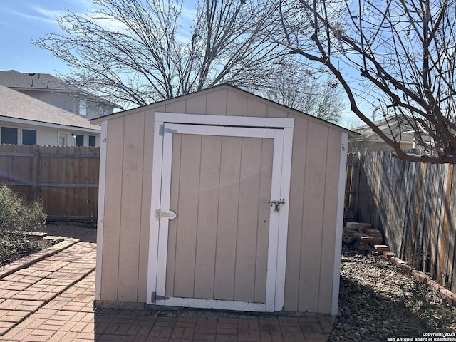 view of shed featuring a fenced backyard