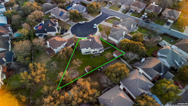 birds eye view of property with a residential view