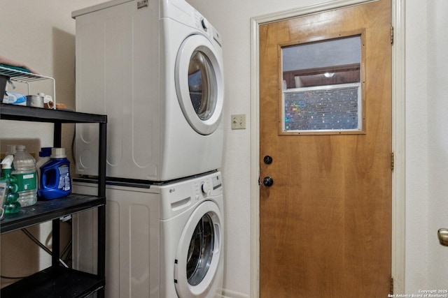 laundry room featuring laundry area and stacked washer and clothes dryer