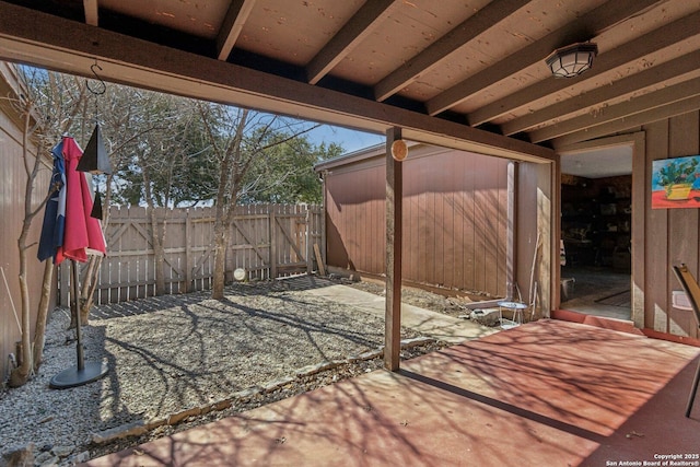 view of patio featuring fence