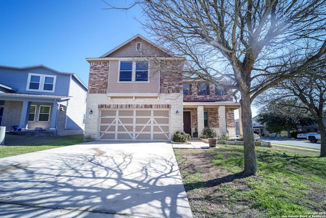 view of front of home featuring a garage, concrete driveway, and a front lawn