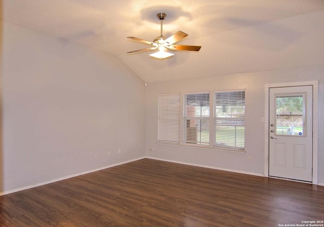 1102 E Hancock, Beeville, TX 78102 - foyer with lofted ceiling, dark wood-style flooring, a ceiling fan, and baseboards