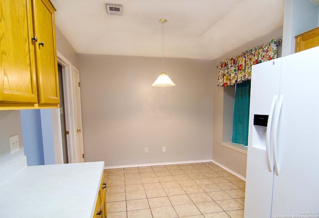 1102 E Hancock, Beeville, TX 78102 - unfurnished dining area featuring light tile patterned flooring and baseboards