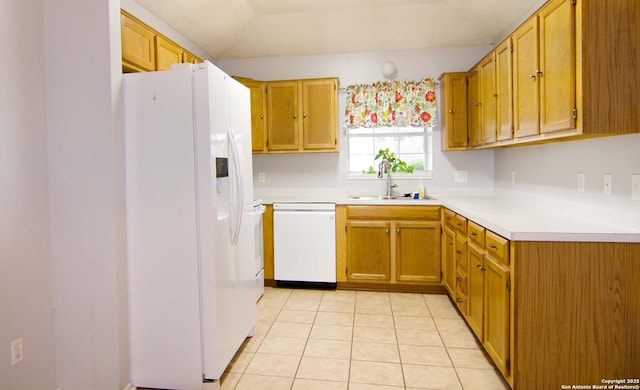 1102 E Hancock, Beeville, TX 78102 - kitchen with white appliances, a sink, light countertops, and light tile patterned flooring