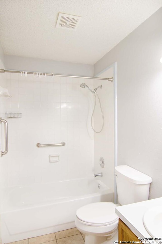 1102 E Hancock, Beeville, TX 78102 - bathroom featuring vanity, tile patterned floors, toilet, and shower / bathtub combination