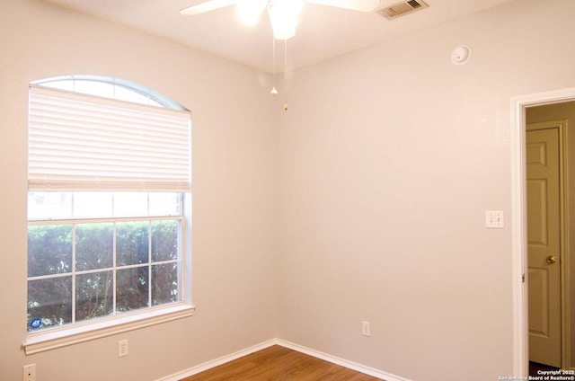1102 E Hancock, Beeville, TX 78102 - spare room featuring a ceiling fan, wood finished floors, baseboards, and a smoke detector