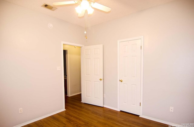 1102 E Hancock, Beeville, TX 78102 - unfurnished bedroom with wood finished floors, baseboards, and a ceiling fan