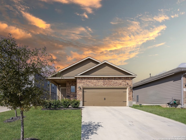 ranch-style house featuring an attached garage, brick siding, concrete driveway, and a front yard