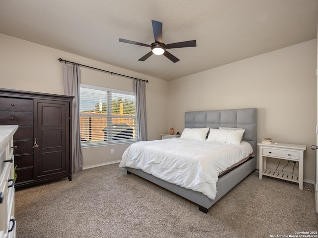 bedroom featuring light carpet, baseboards, and a ceiling fan