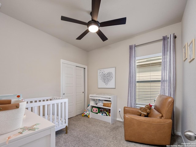 bedroom with a ceiling fan, carpet, a closet, and baseboards