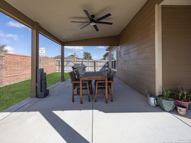 view of patio / terrace with ceiling fan, outdoor dining area, and a fenced backyard