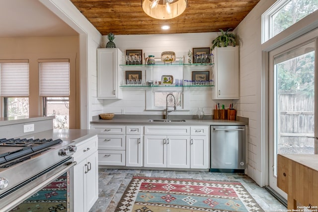 kitchen featuring appliances with stainless steel finishes, a sink, wood ceiling, and a healthy amount of sunlight