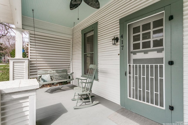 view of patio with a porch and a ceiling fan