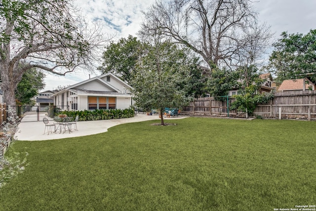 view of yard with a patio area and a fenced backyard