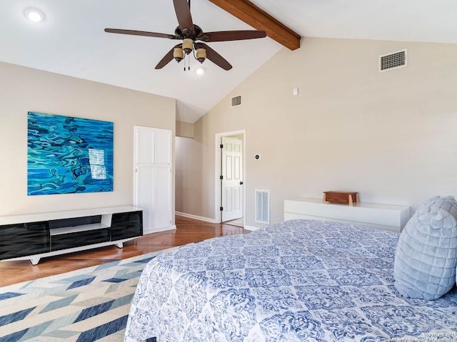 bedroom featuring beam ceiling, visible vents, and high vaulted ceiling