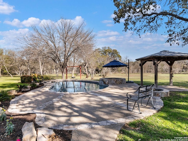 outdoor pool with a gazebo, a patio area, and a lawn