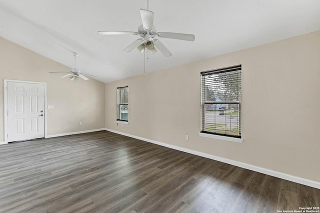 spare room with lofted ceiling, plenty of natural light, and wood finished floors