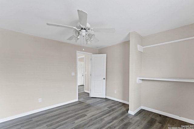 spare room featuring ceiling fan, wood finished floors, and baseboards