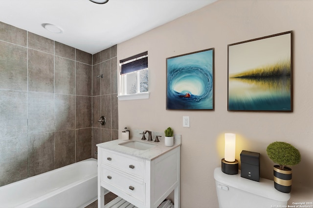 bathroom with shower / bath combination, vanity, and toilet