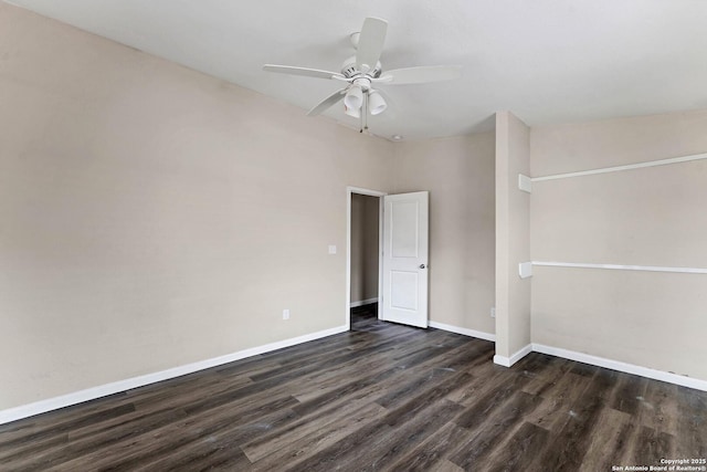 spare room featuring ceiling fan, baseboards, and dark wood-type flooring