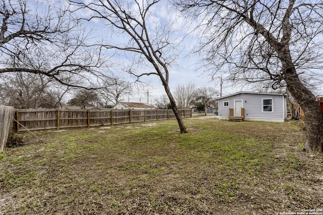 view of yard with a fenced backyard