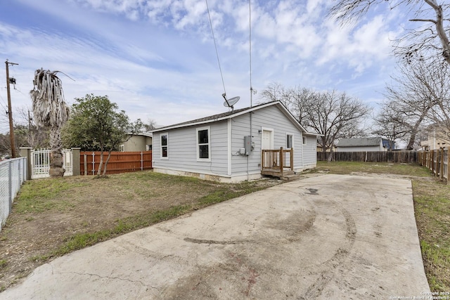 back of house featuring a fenced backyard