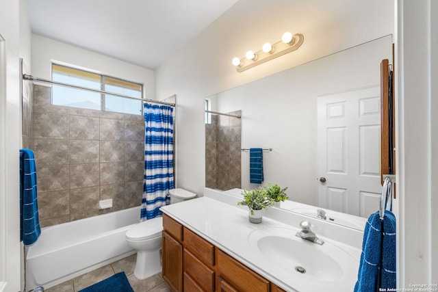 full bathroom featuring toilet, vanity, shower / bath combo with shower curtain, and tile patterned floors