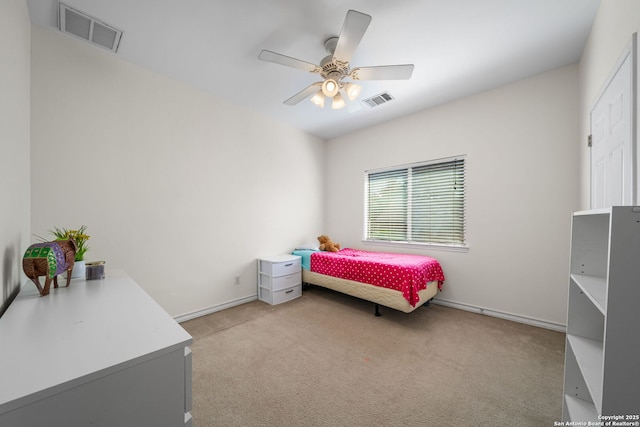 carpeted bedroom with baseboards, visible vents, and a ceiling fan