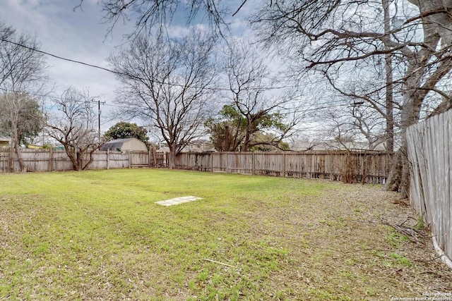 view of yard with a fenced backyard