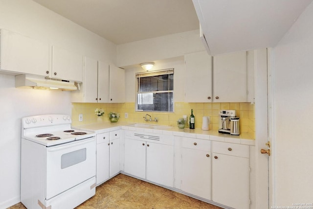 kitchen with electric range, decorative backsplash, white cabinetry, and under cabinet range hood