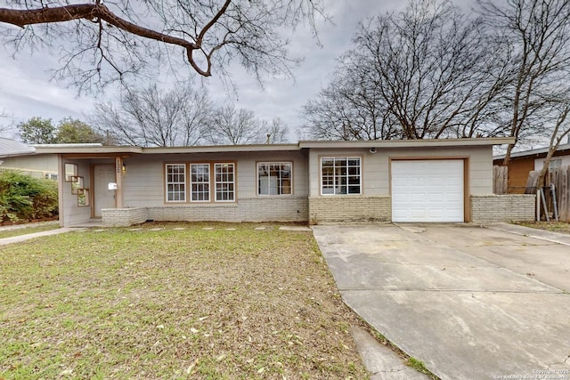 ranch-style house with a garage, driveway, brick siding, fence, and a front yard