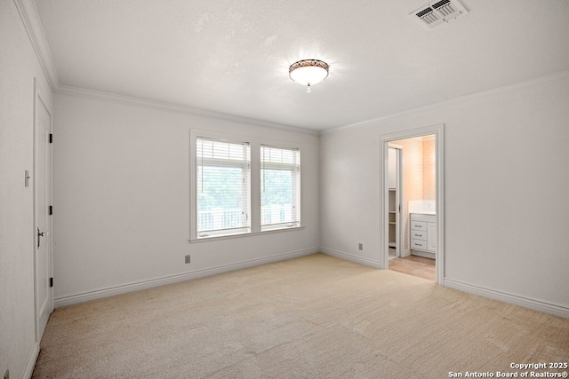 unfurnished bedroom featuring light colored carpet, visible vents, ornamental molding, a textured ceiling, and baseboards