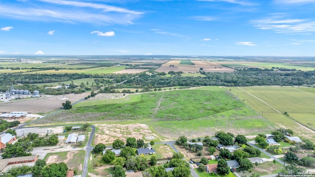 birds eye view of property with a rural view