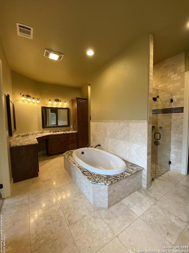 full bath with tile patterned flooring, a garden tub, vanity, visible vents, and a stall shower