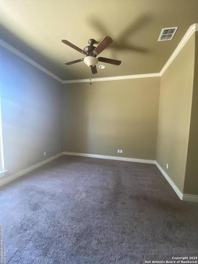 unfurnished room with baseboards, ceiling fan, visible vents, and crown molding