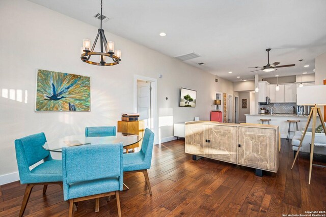 dining room with visible vents, baseboards, ceiling fan with notable chandelier, recessed lighting, and dark wood-style floors