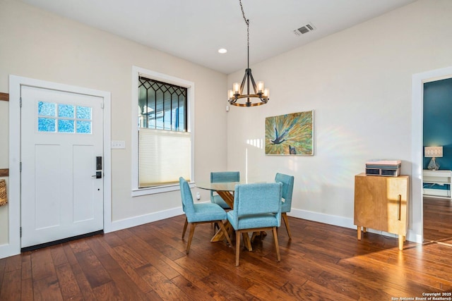 dining room with visible vents, dark wood-style floors, recessed lighting, an inviting chandelier, and baseboards