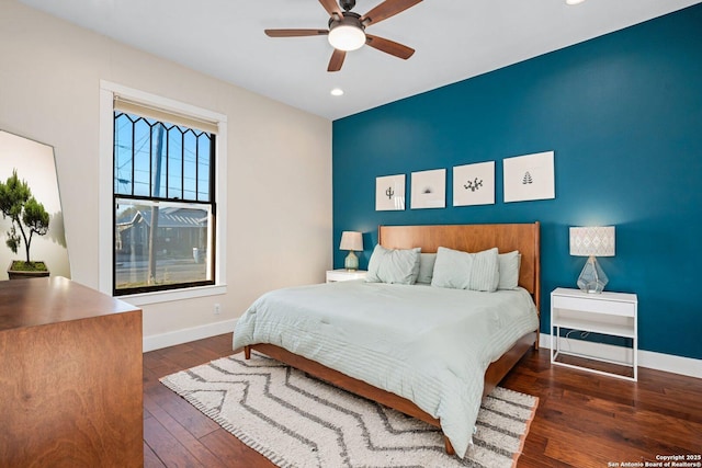 bedroom with hardwood / wood-style floors, recessed lighting, baseboards, and ceiling fan