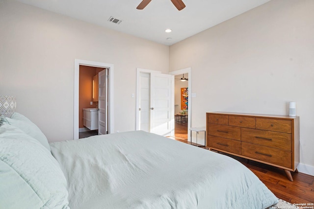 bedroom featuring visible vents, recessed lighting, wood finished floors, ensuite bath, and a ceiling fan