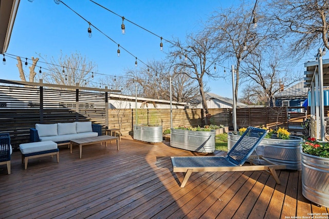 deck featuring fence and an outdoor hangout area