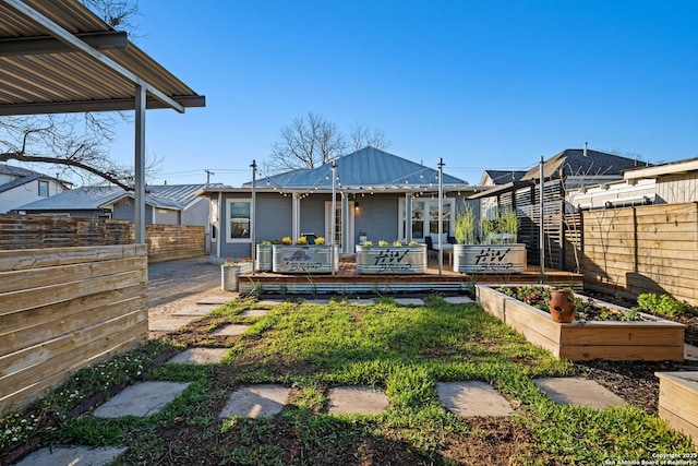 view of yard featuring a vegetable garden and a fenced backyard