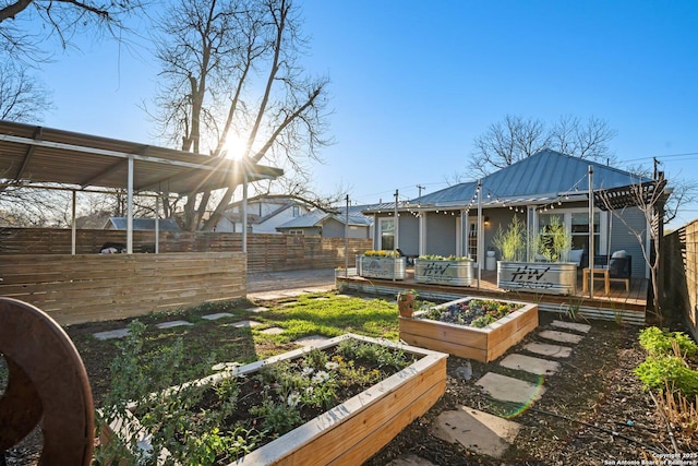 view of yard with a vegetable garden and fence