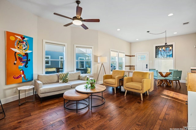 living room with visible vents, recessed lighting, baseboards, and dark wood-style flooring