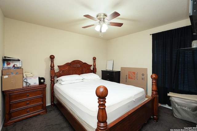 bedroom with a ceiling fan and dark carpet