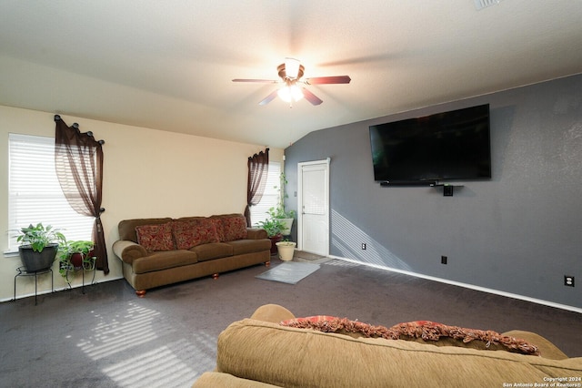 carpeted living area with lofted ceiling, baseboards, and a ceiling fan