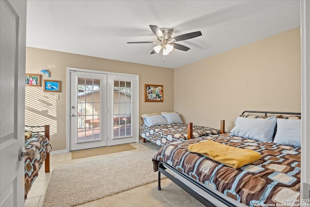 bedroom featuring access to exterior, a ceiling fan, and french doors