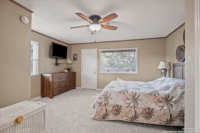 bedroom with baseboards, multiple windows, ornamental molding, and carpet flooring