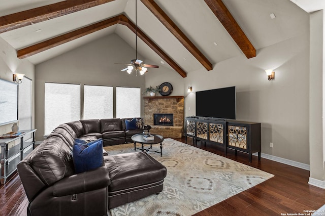 living area featuring baseboards, wood finished floors, a stone fireplace, high vaulted ceiling, and beam ceiling