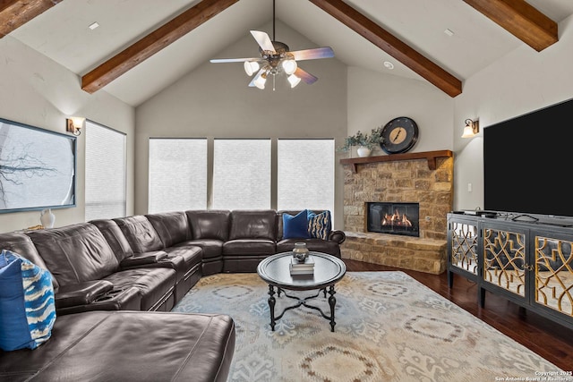 living room featuring a wealth of natural light, wood finished floors, a fireplace, high vaulted ceiling, and beam ceiling