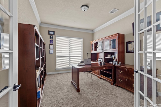 carpeted office with french doors, visible vents, crown molding, and a textured ceiling